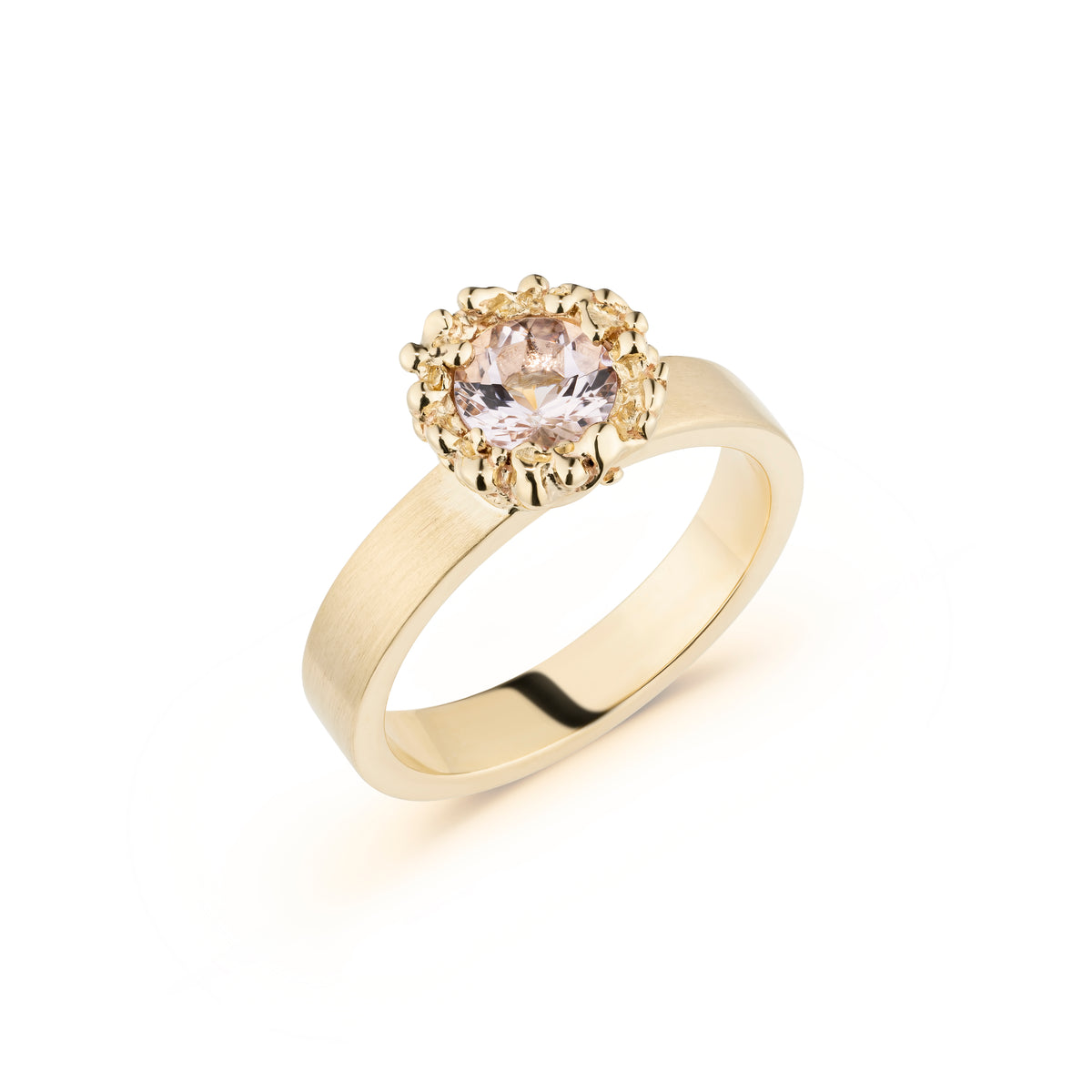 Gold ring with a diamond on a white background