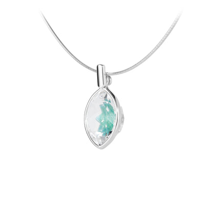 Silver pendant with a green gemstone on a white background